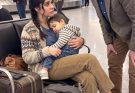 At JFK Airport, I discovered my widowed daughter-in-law cradling my sleeping grandson, with three worn suitcases beside her and a one-way ticket someone else had arranged without her consent.